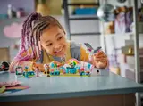 Child playing with the LEGO Friends party set.