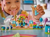Child interacts with minifigures.