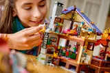 Girl playing with cabin interior.