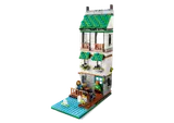 Three-story townhouse by water.