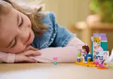 Child immersed in LEGO play.