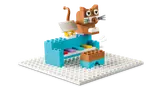 LEGO cat playing a blue piano.