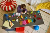 Child building LEGO.