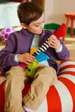 Child playing LEGO guitar.