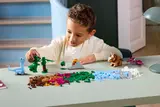 Child playing with Lego dinosaurs.