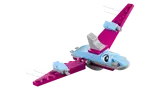Pink and blue Lego pterodactyl flying.