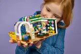 Child playing with Flower Shop interior.