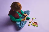 Child building LEGO.