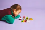 Child playing with LEGO food.