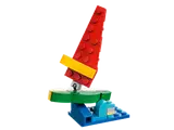LEGO sailboat with red sail.
