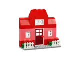 LEGO red and pink house with picket fence.