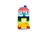 Tall rainbow-striped LEGO house.