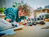 Child playing with police garage set.