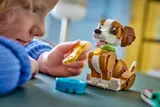 Child playing with LEGO puppy.