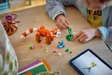 Child building LEGO plants.