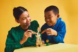 Kids playing with LEGO bunny.