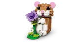 LEGO hamster holding a purple flower.