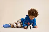 Child playing with mech