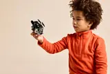 Child holding the small Imperial transport.