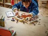 Child building the Desert Skiff set.