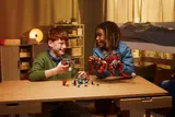 Kids playing with the Dino Jet and minifigures.