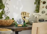 LEGO T. rex skull display in room.