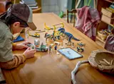 Child building truck cab with digital instructions.