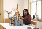 Builder with the LEGO Disney Castle.