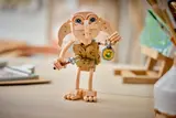 Close-up of sad LEGO Dobby holding sock and locket.