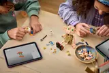 Children building LEGO Dobby together at a table.