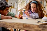 Children playing with built LEGO Dobby and lamp.