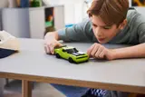 Boy playing with LEGO Hellcat.