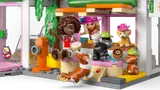 Close-up of the bakery's outdoor area with characters and dogs.