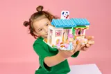 Child holding the Dog Treats Bakery set.