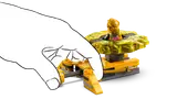 Hand launching a golden Spinjitzu spinner.