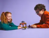 Children playing with Ninjago Spinjitzu set.