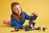 Child playing with Ninjago tower