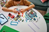 Child building LEGO car wash.