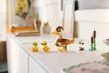 LEGO duck family on white cabinet.