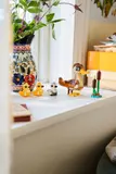 LEGO duck family on windowsill.