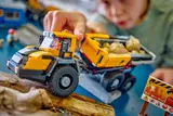 LEGO dump truck on rough terrain.
