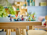LEGO Friends Electric Car and Charger set on a wooden table.