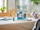 Elsa's ice cream cart and accessories on a table.