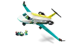 Air Ambulance jet in flight, snowmobile below.