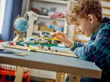 Boy playing with LEGO Air Ambulance.