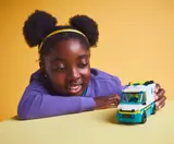Child holding ambulance.