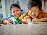 Child playing with LEGO ambulance and snowboarder.