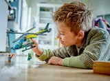 Child playing with helicopter.