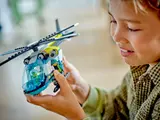 Child's hands holding helicopter.