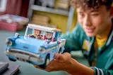 Holding the Anglia and minifigures.
